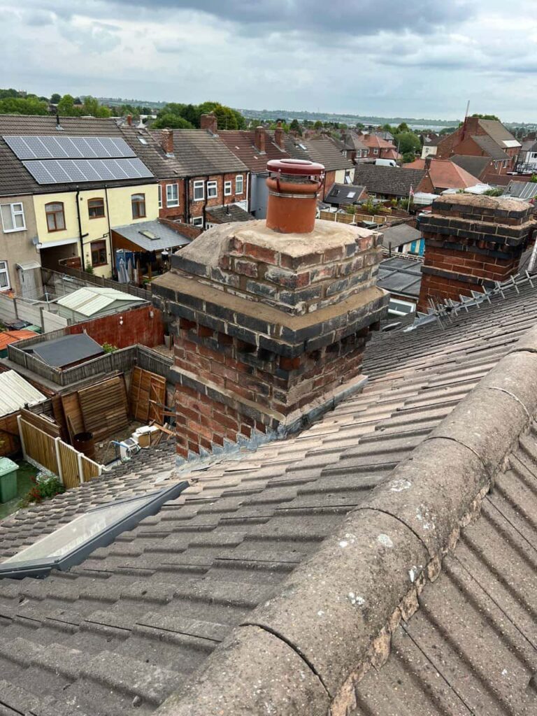 This is a photo taken from a roof which is being repaired by Haywards Heath Roofing Repairs, it shows a street of houses, and their roofs